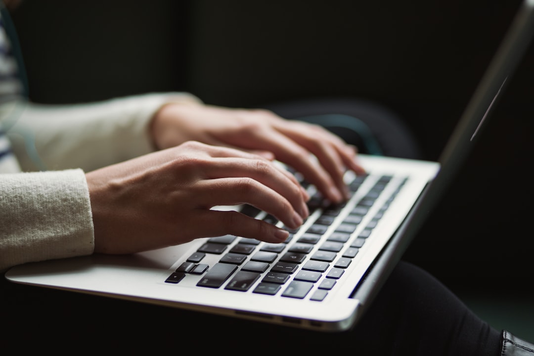 Customer service agent working alongside AI assistance tools on multiple screens