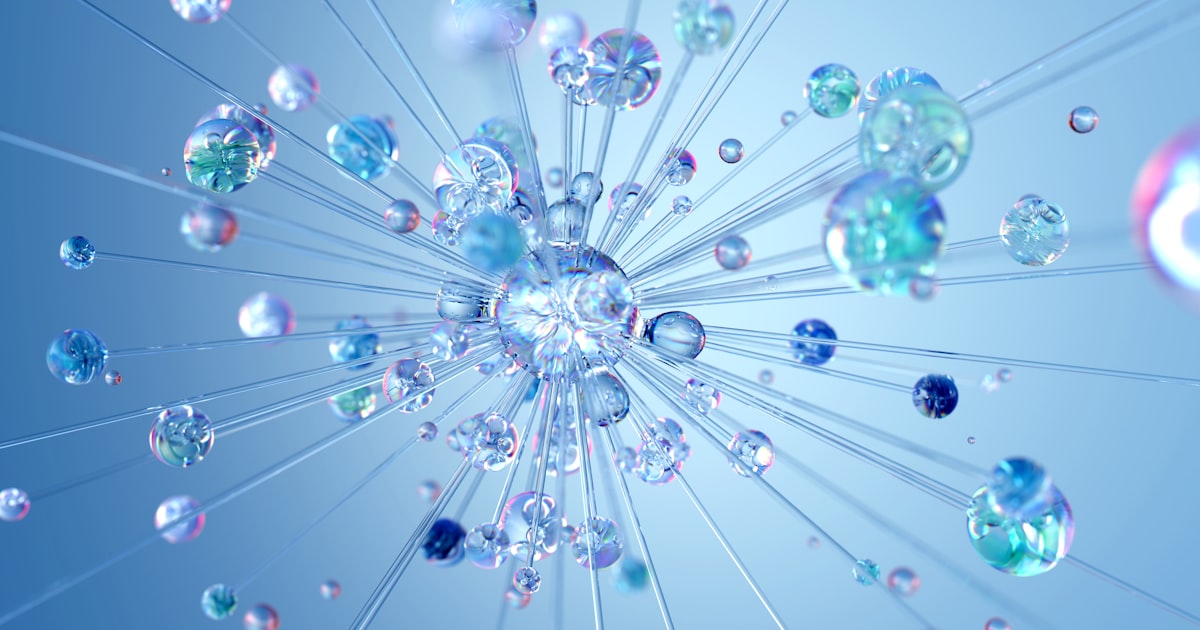 Developer working with AI-assisted coding tools on multiple monitors