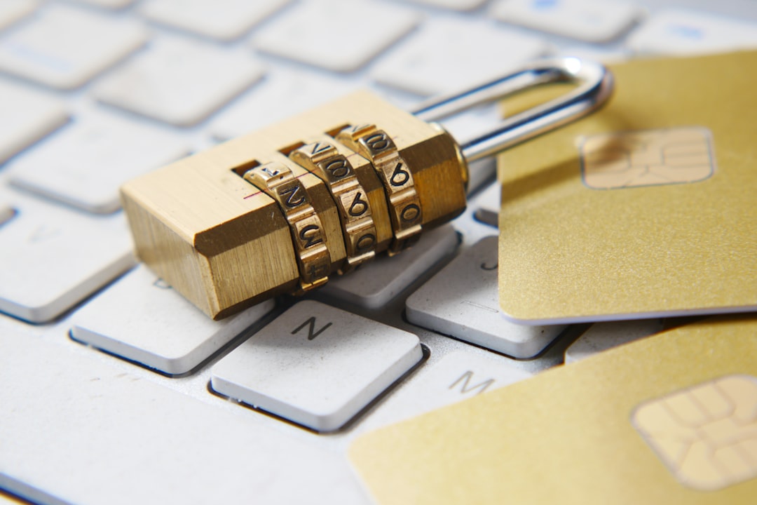 A golden padlock sitting on top of a keyboard, symbolizing cybersecurity protection