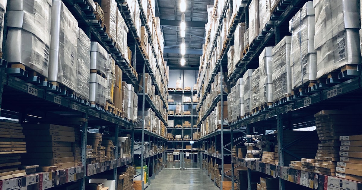 Modern warehouse workspace with organized inventory management system
