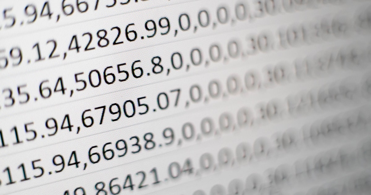 Business professional transitioning from spreadsheet to modern system dashboard