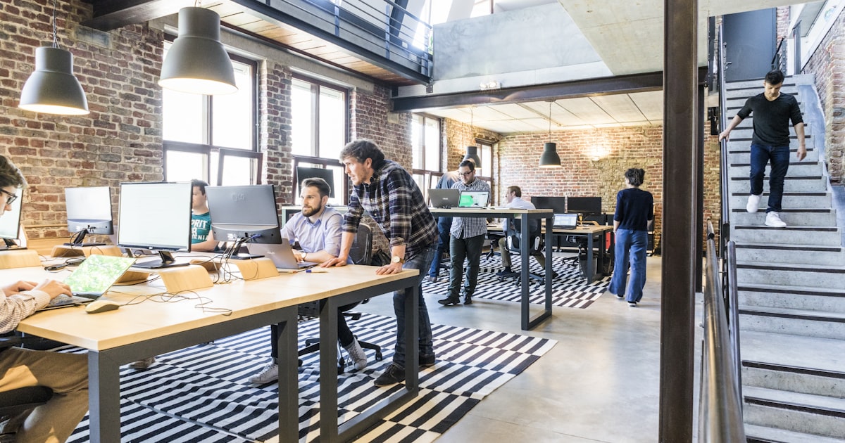 Business partners shaking hands over successful project collaboration